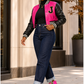 Pink Python Reloaded zebra and pink boots styled casually with dark denim and a pink varsity jacket