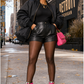 Pink Python Reloaded zebra and pink boots styled with black leather shorts in a Detroit street fashion editorial